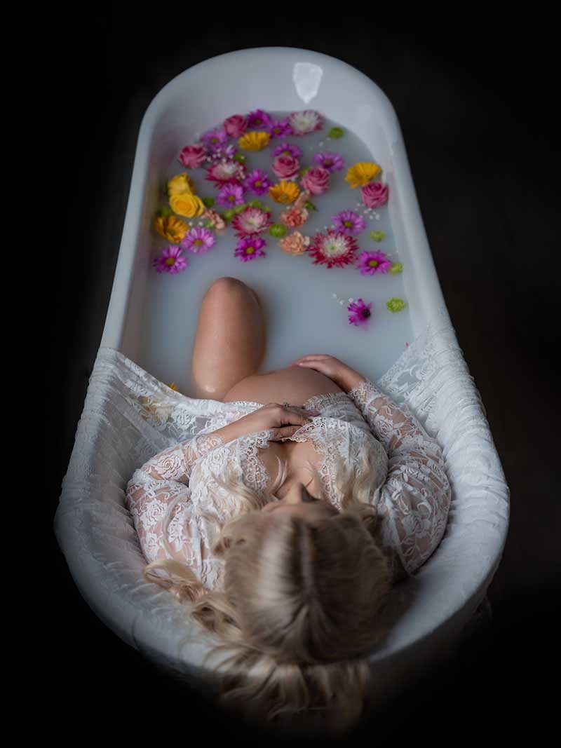 Milk bath maternity portrait by Maternity Haus