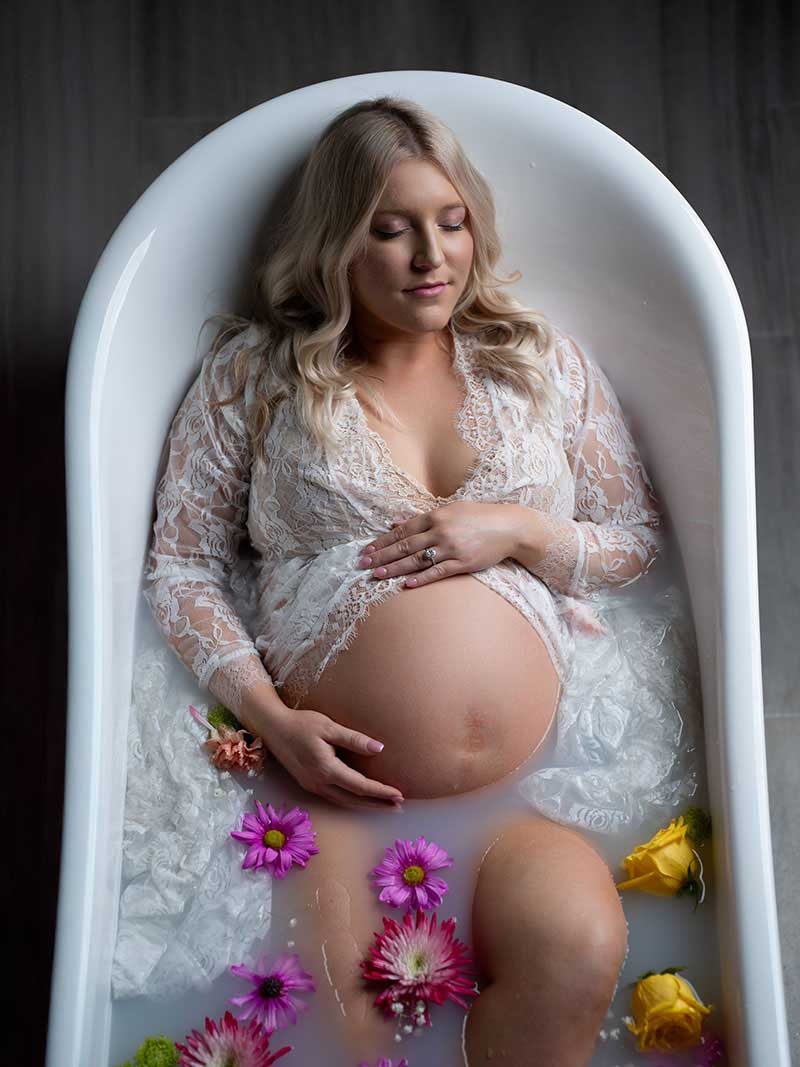 Milk bath maternity portrait by Maternity Haus
