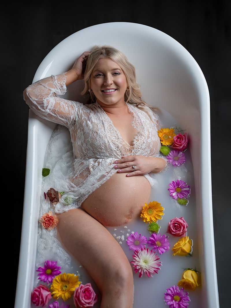 Milk bath maternity portrait by Maternity Haus