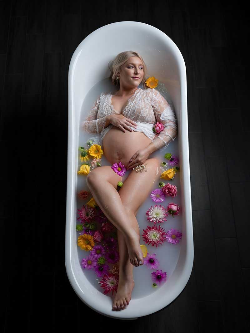 Milk bath maternity portrait by Maternity Haus