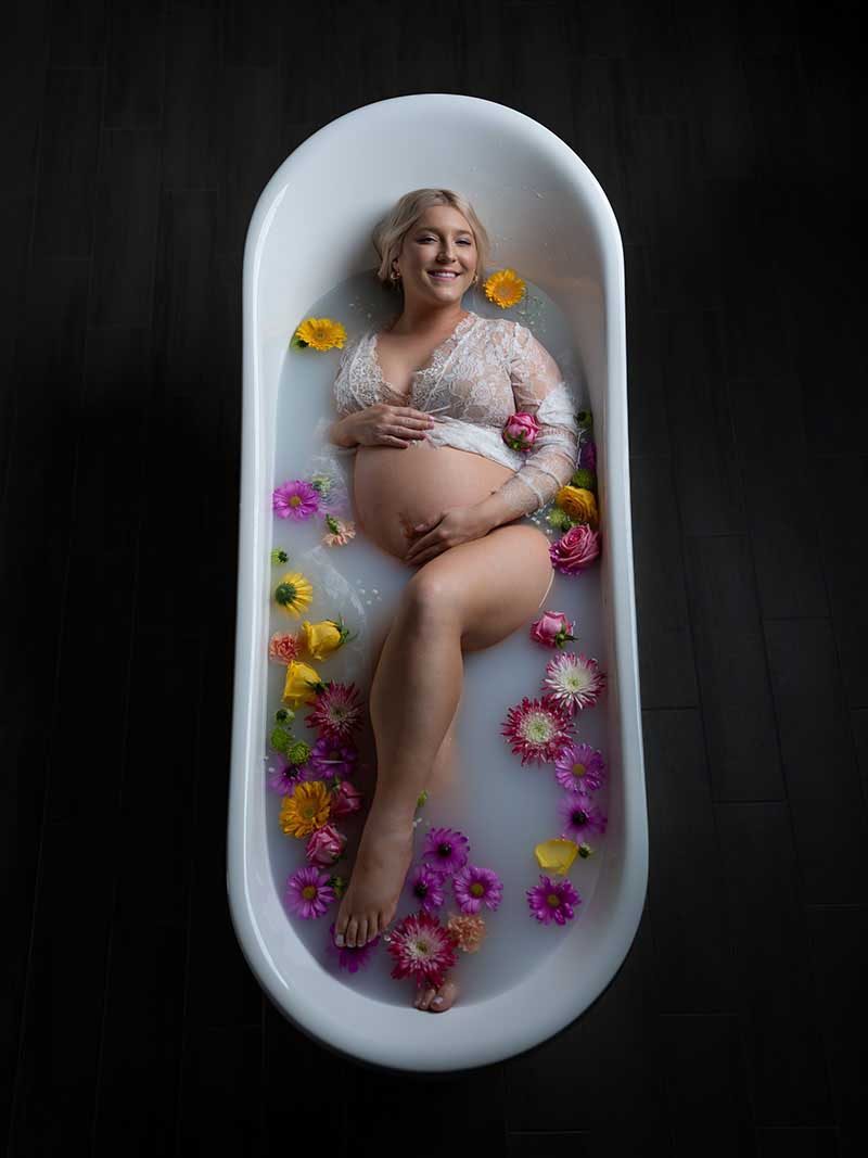 Milk bath maternity portrait by Maternity Haus